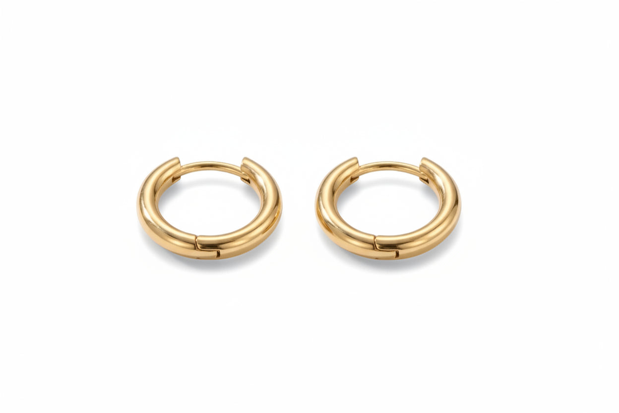 Gold hoop earrings on a white background