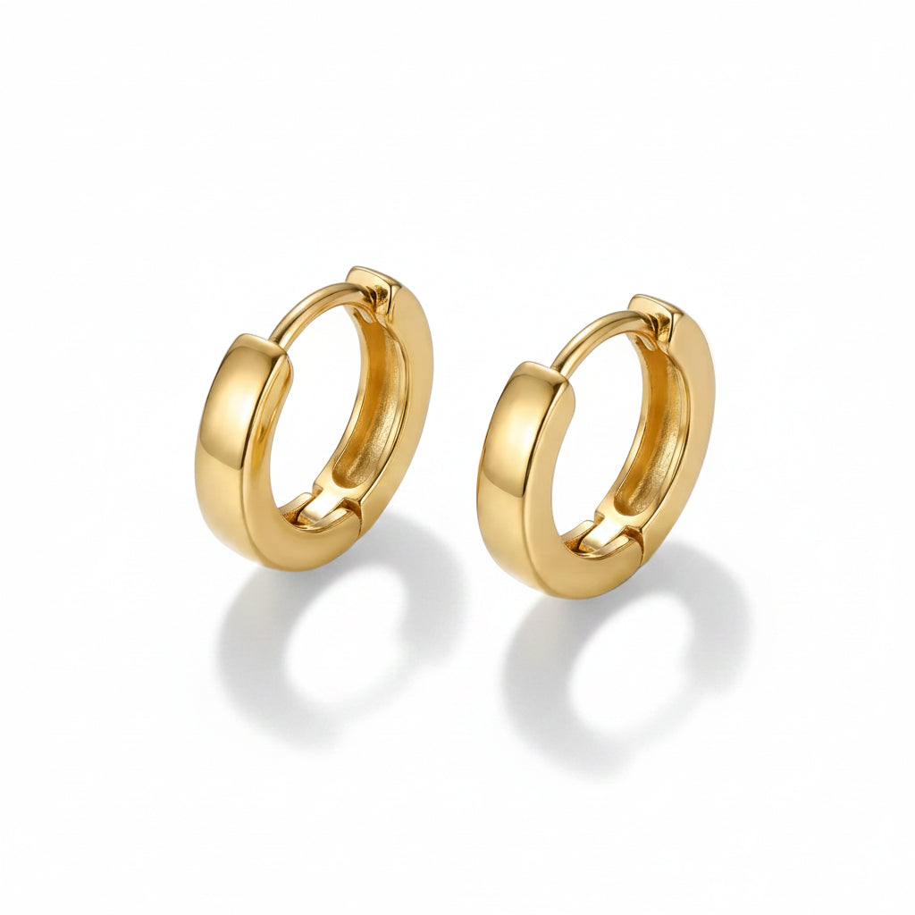 Pair of gold hoop earrings on a white background